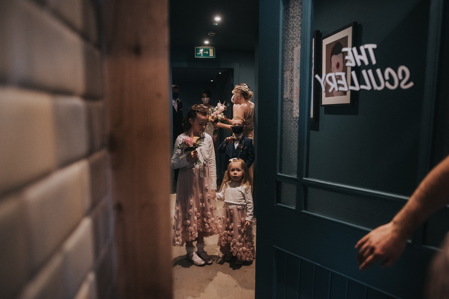 Young children wait outside to enter the room for a wedding at The Bothy Glasgow