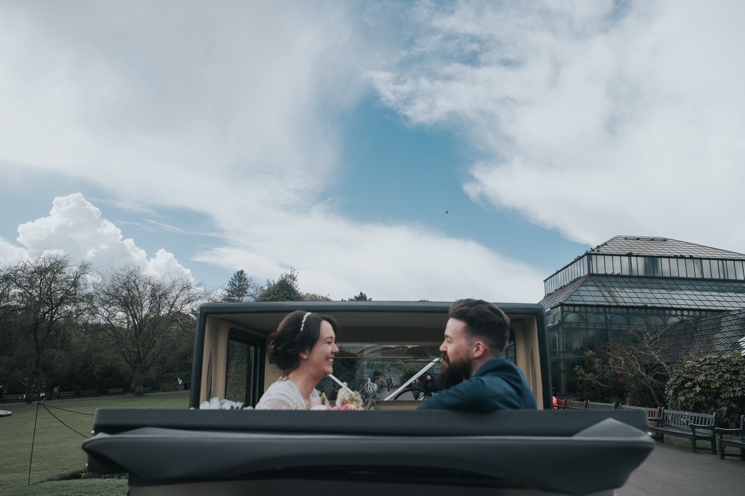 Wedding couple sit in their car A couple shoot at Glasgow Botanic Gardens at the Bothy Glasgow