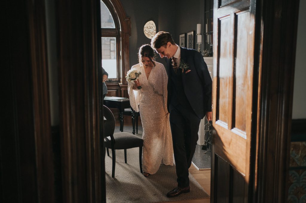 The bride and groom leave the ceremony room at 23 Montrose street