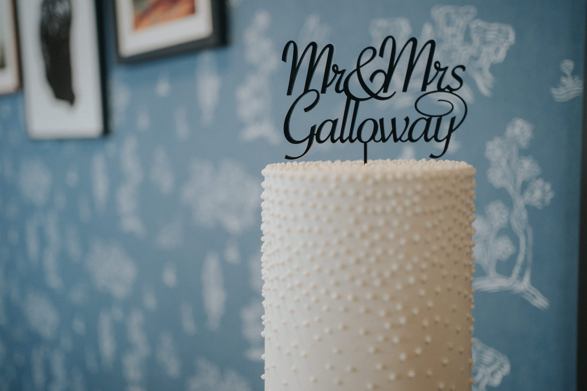 A cake topper that says Mr & Mrs Galloway