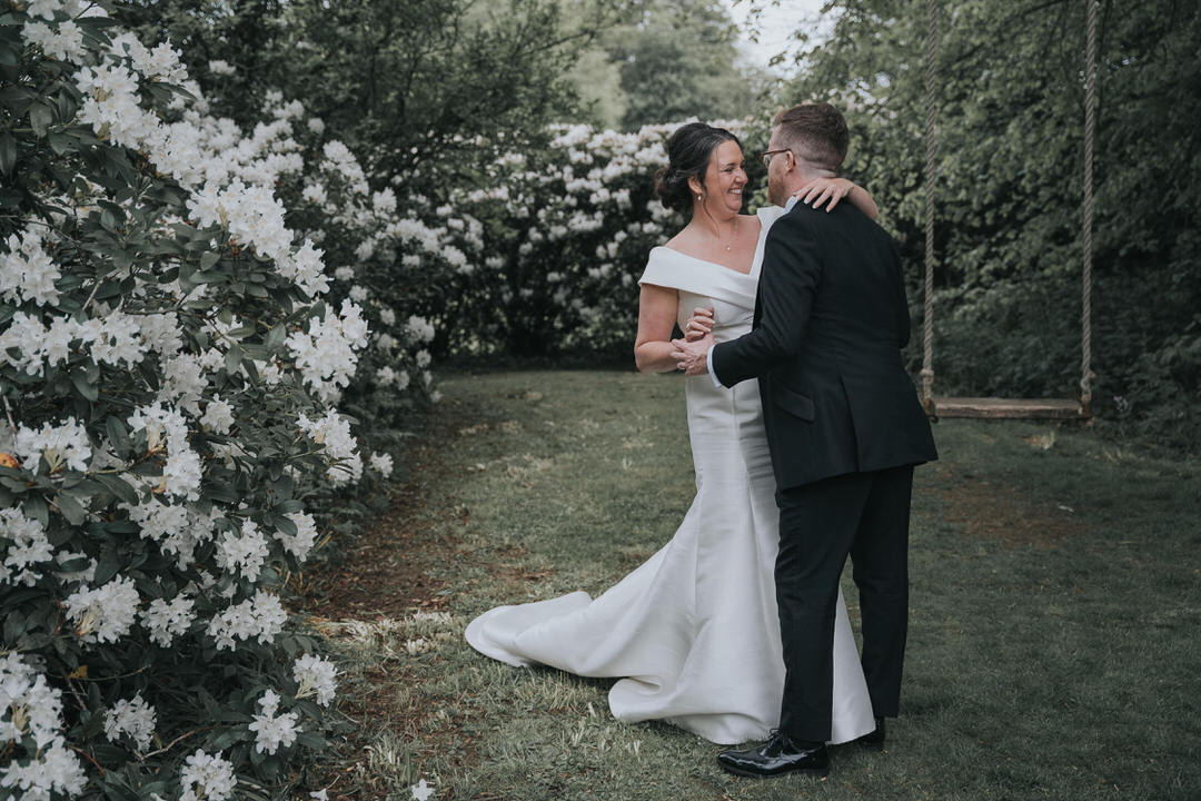 A bride and groom dancing in the gardens of Balbirnie house Hotel 