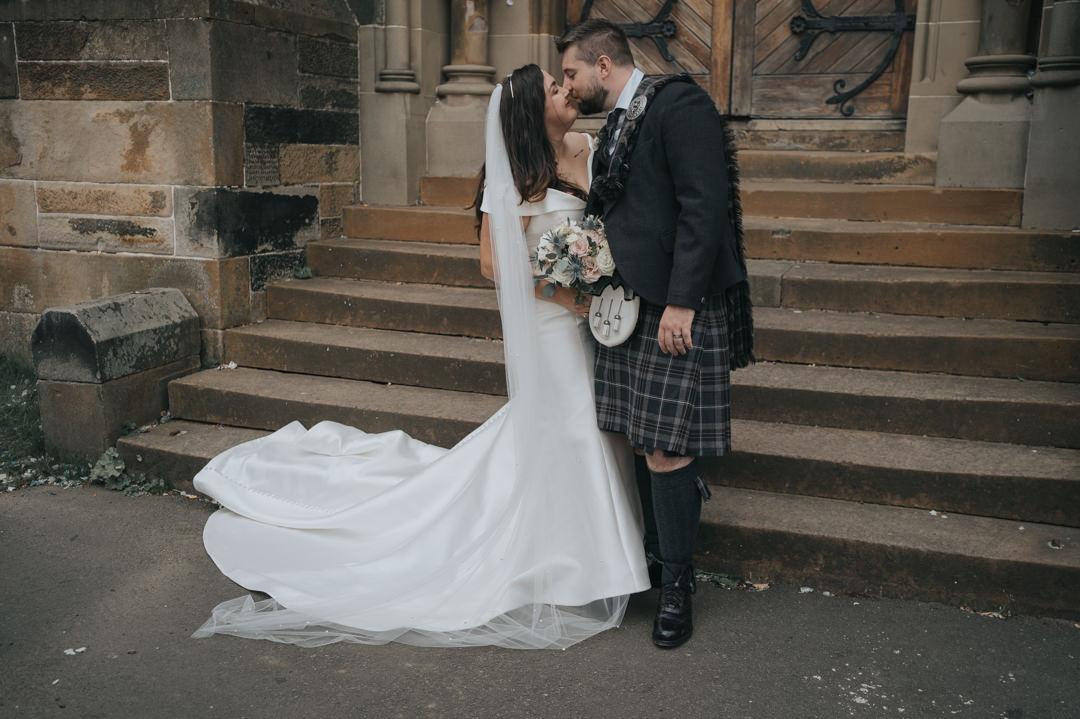 Bride and Groom having a kiss at Cottiers Wedding in Glasgow