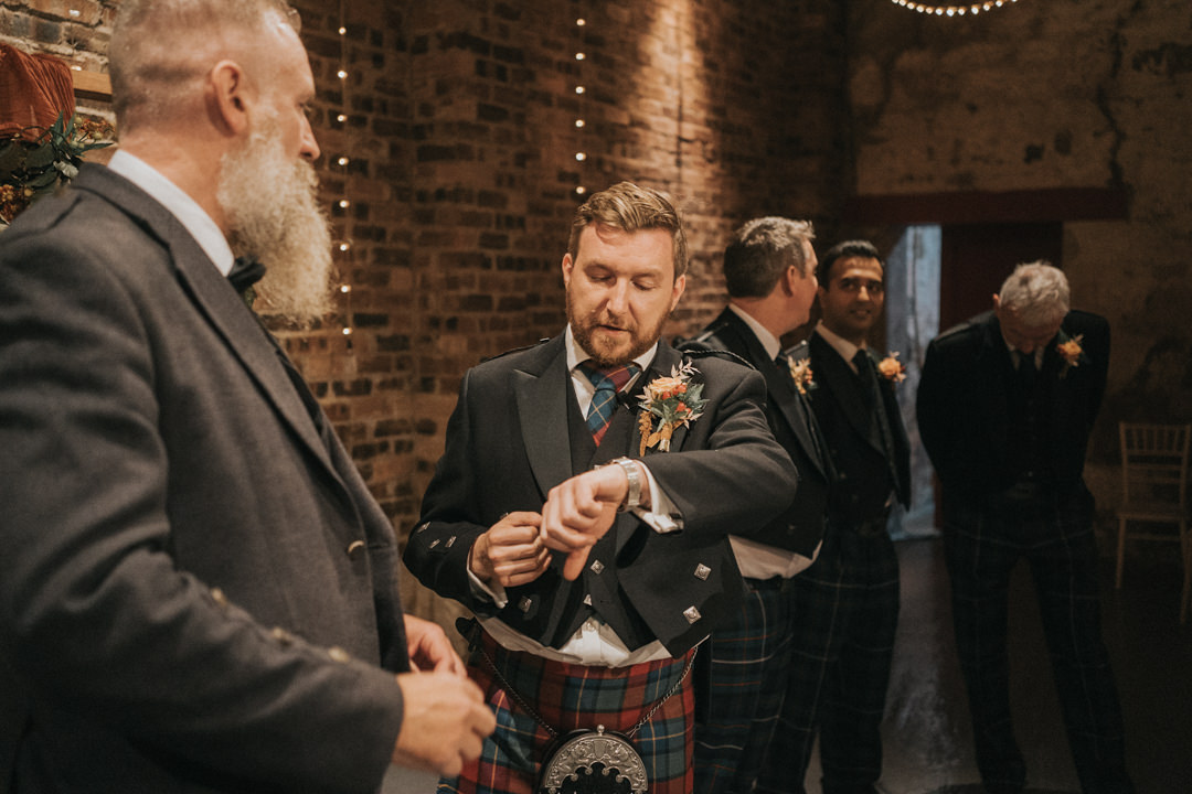 The Groom checks his watch at his wedding at Kinkell Byre Wedding in September