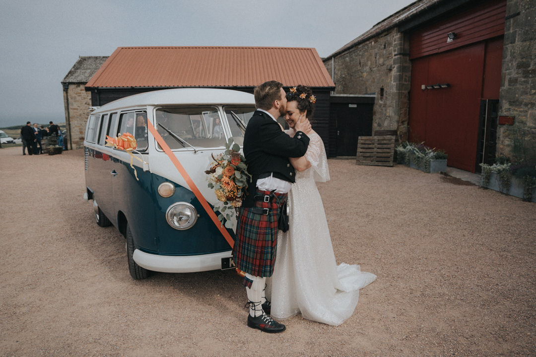 The couple share a kiss in a camper van at Kinkell Byre in September