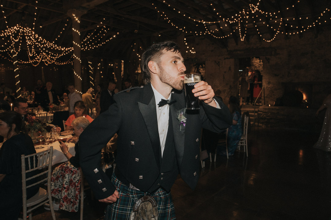 An Australian man drinking Guinness at Kinkell Byre
