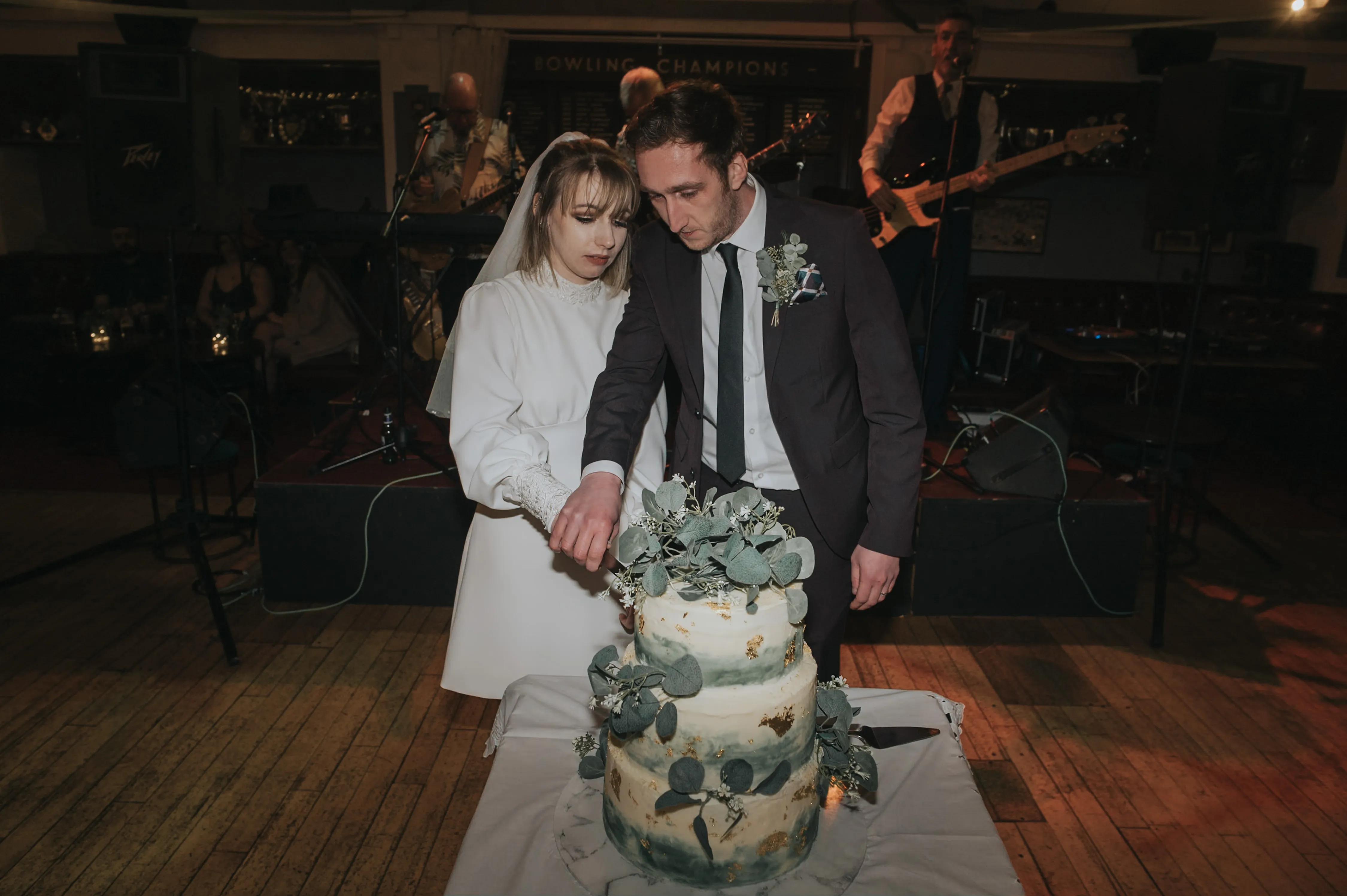 Cake cutting at a Queens Park Bowling Club Wedding